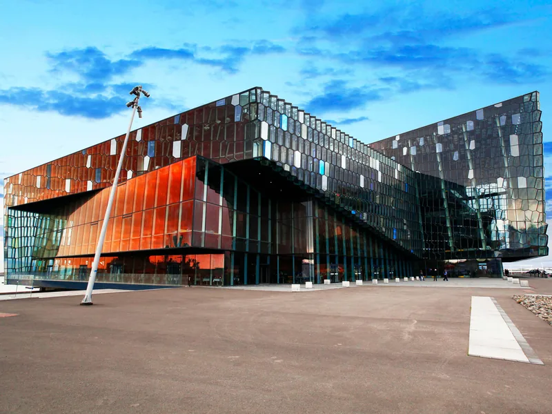 The glass honeycomb façade of Harpa Concert Hall at dusk